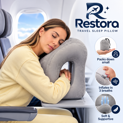 Woman asleep on the grey Restora pillow on an airplane tray table, with insets of the carry pouch and the inflation valve
